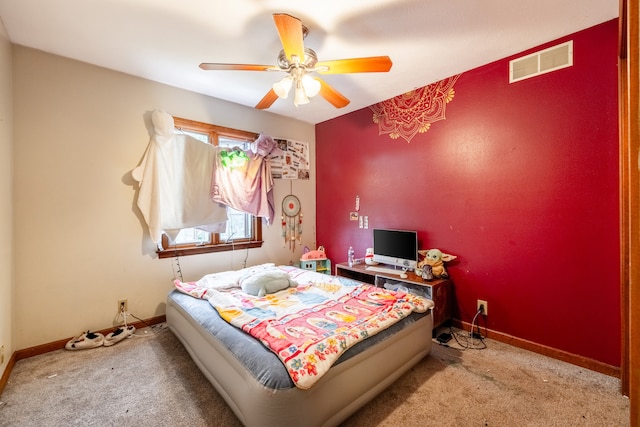 bedroom featuring ceiling fan and light colored carpet