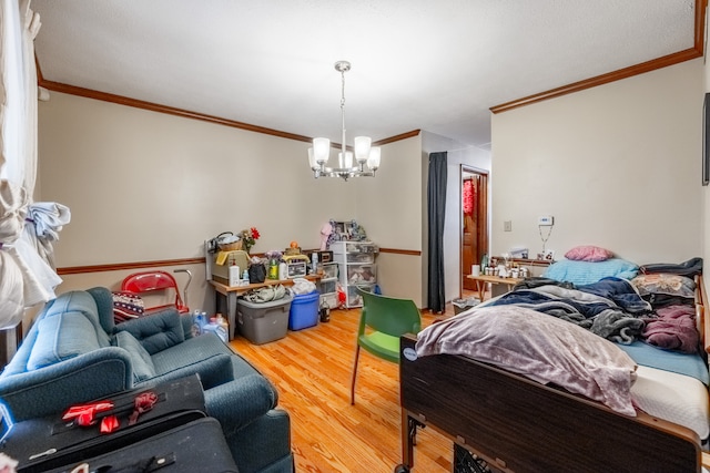 interior space featuring ornamental molding, a chandelier, and hardwood / wood-style flooring