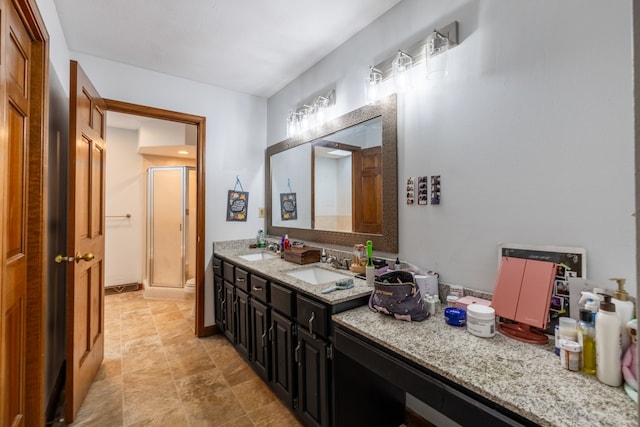 bathroom with vanity, toilet, and an enclosed shower