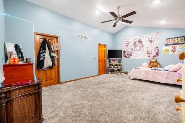 bedroom with ceiling fan, carpet flooring, lofted ceiling, and a closet