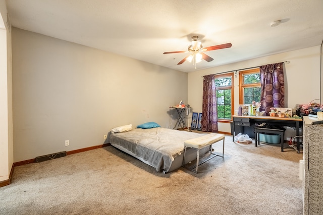 bedroom with ceiling fan and carpet flooring