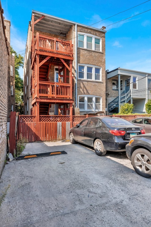 view of front of home featuring a balcony