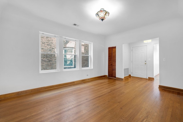 empty room featuring hardwood / wood-style flooring