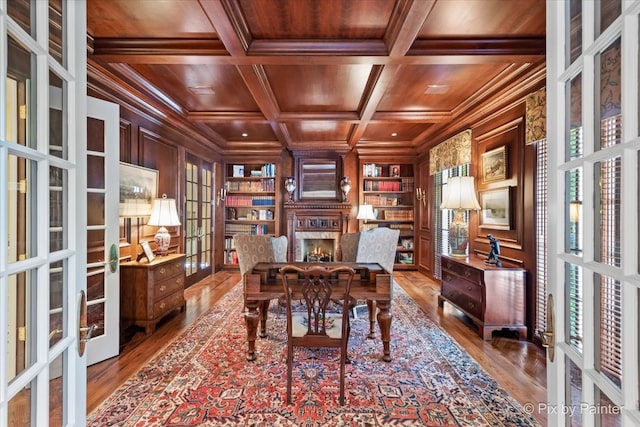 home office featuring french doors, coffered ceiling, wooden ceiling, hardwood / wood-style floors, and a healthy amount of sunlight