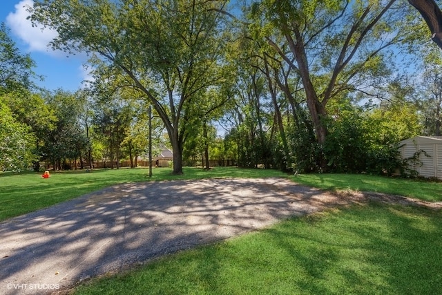 view of basketball court featuring a lawn