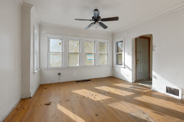 unfurnished room with ceiling fan, light hardwood / wood-style flooring, and ornamental molding