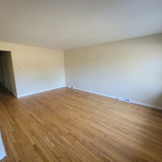 empty room with light wood-type flooring