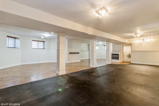 basement with hardwood / wood-style floors