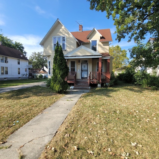 view of front of property with a front lawn and a porch