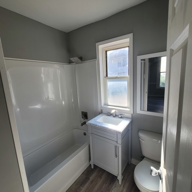 full bathroom with vanity, toilet, shower / washtub combination, and hardwood / wood-style flooring