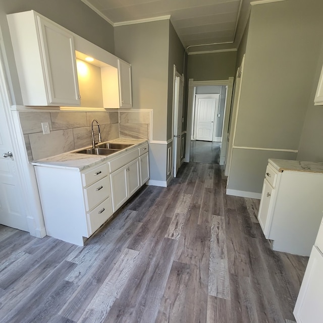 kitchen featuring white cabinetry, dark hardwood / wood-style floors, and sink