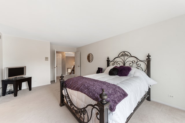 bedroom with light colored carpet