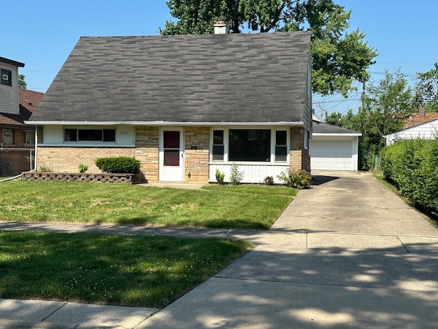 view of front facade with a front yard and a garage