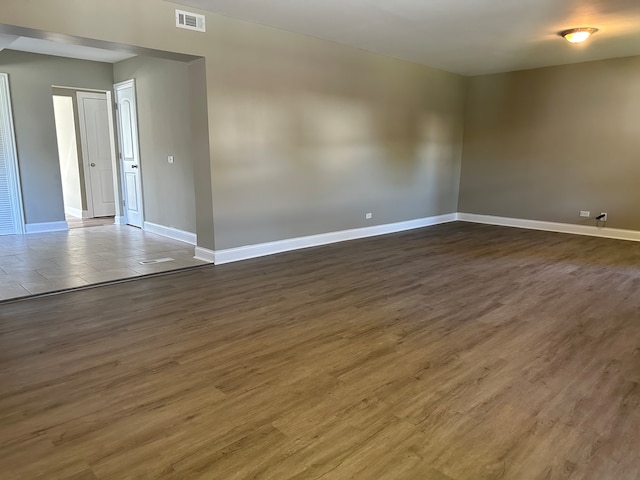 spare room featuring dark hardwood / wood-style floors