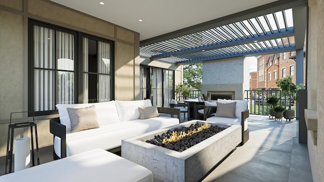 view of patio / terrace with an outdoor living space with a fire pit