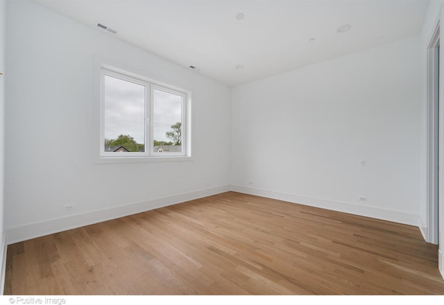 empty room featuring wood-type flooring