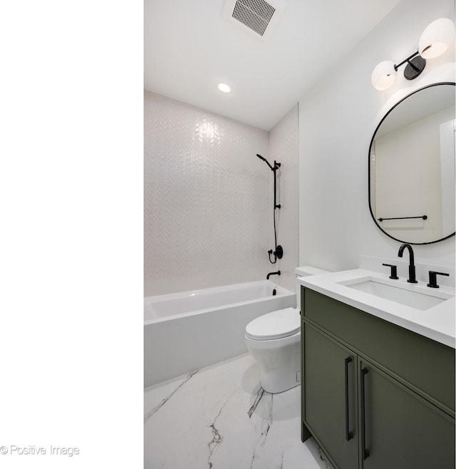 full bathroom with vanity, tiled shower / bath combo, and toilet