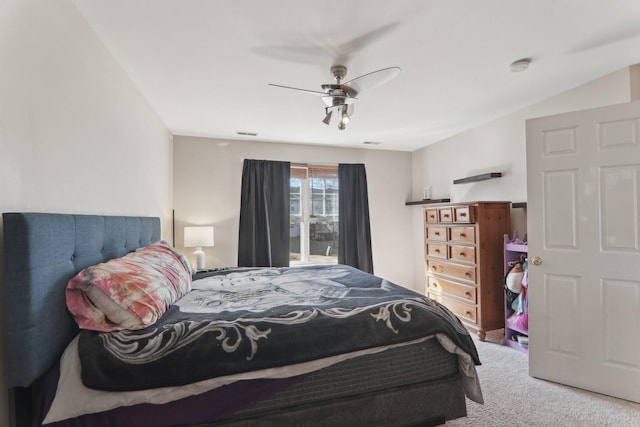 carpeted bedroom with visible vents and a ceiling fan