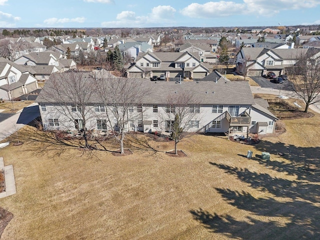 birds eye view of property with a residential view