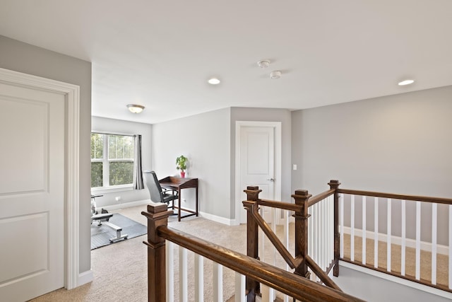 hallway with baseboards, recessed lighting, an upstairs landing, and light colored carpet