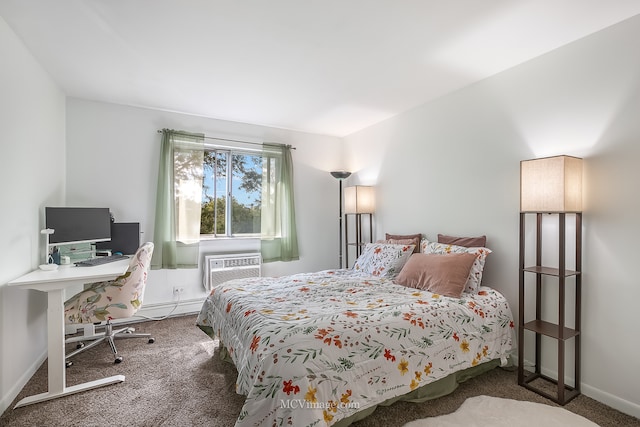 bedroom with an AC wall unit and carpet floors