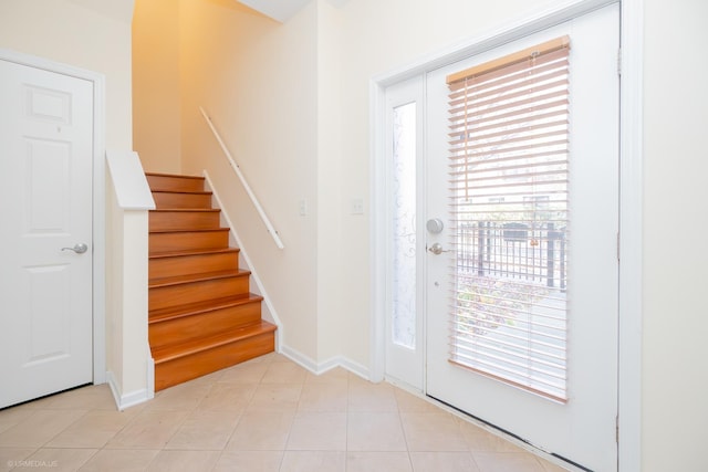 entryway with light tile patterned floors