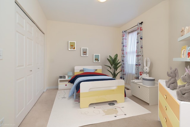 carpeted bedroom with a closet