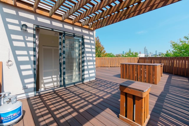 wooden deck featuring a pergola