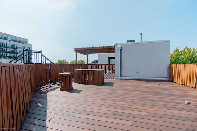 wooden deck featuring a pergola