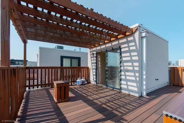 wooden deck featuring a pergola