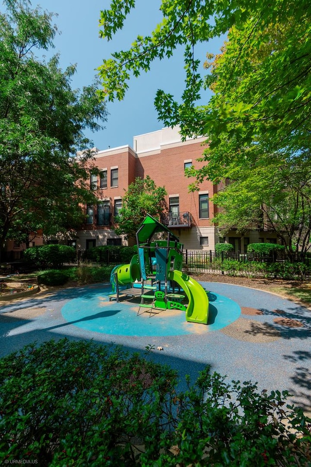 view of swimming pool featuring a playground