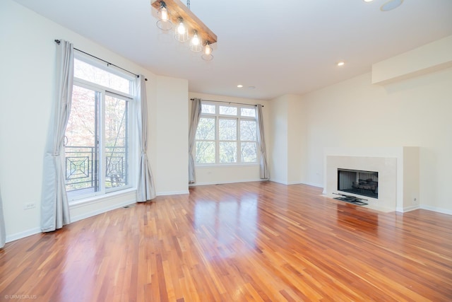 unfurnished living room with light hardwood / wood-style flooring