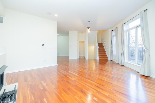 unfurnished living room with light hardwood / wood-style floors