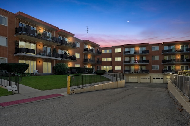 outdoor building at dusk with a garage