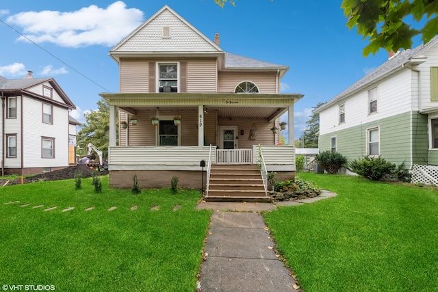 view of front of home with covered porch and a front yard