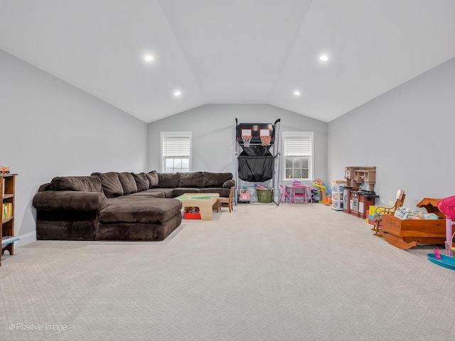 playroom with lofted ceiling and light colored carpet