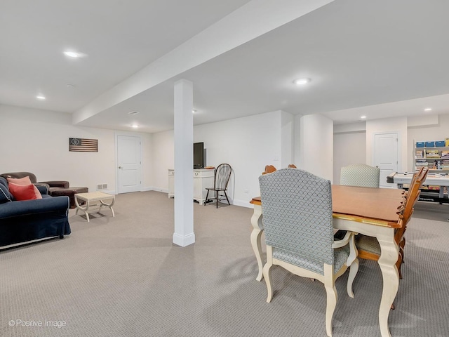 dining space featuring light colored carpet