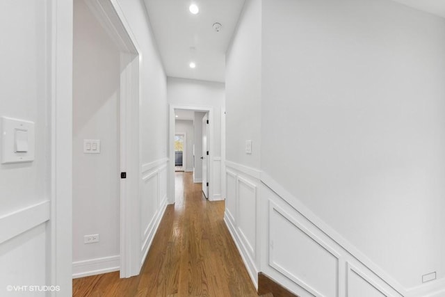 corridor featuring hardwood / wood-style flooring