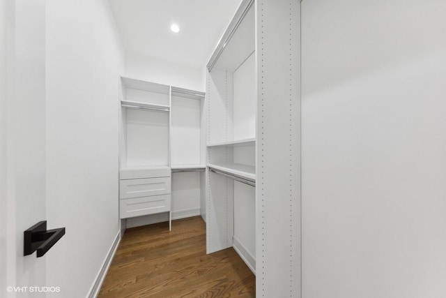 walk in closet featuring hardwood / wood-style floors