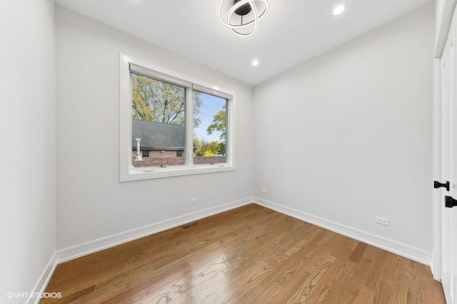 unfurnished room featuring wood-type flooring