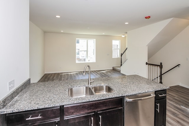 kitchen featuring wood-type flooring, sink, and stainless steel dishwasher