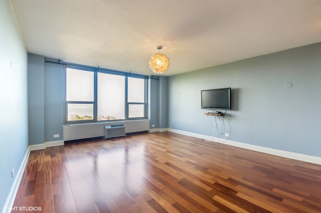 unfurnished living room featuring hardwood / wood-style floors