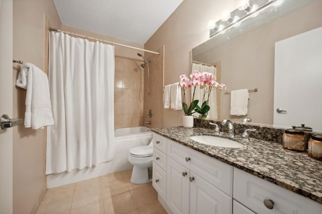 full bathroom featuring shower / tub combo, vanity, tile patterned floors, and toilet