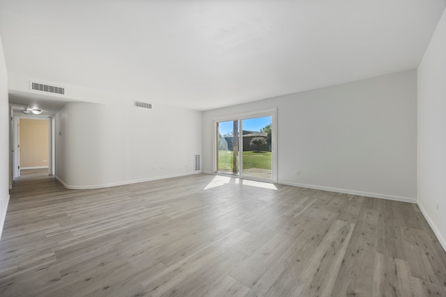 unfurnished room featuring light hardwood / wood-style flooring