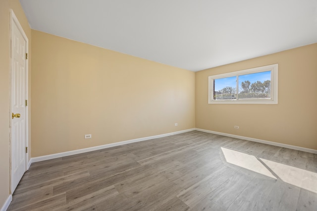 unfurnished room featuring hardwood / wood-style floors