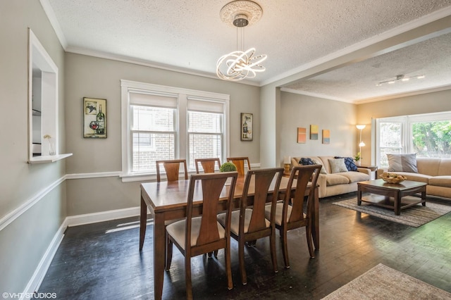 dining space featuring crown molding, a textured ceiling, dark hardwood / wood-style floors, and a chandelier