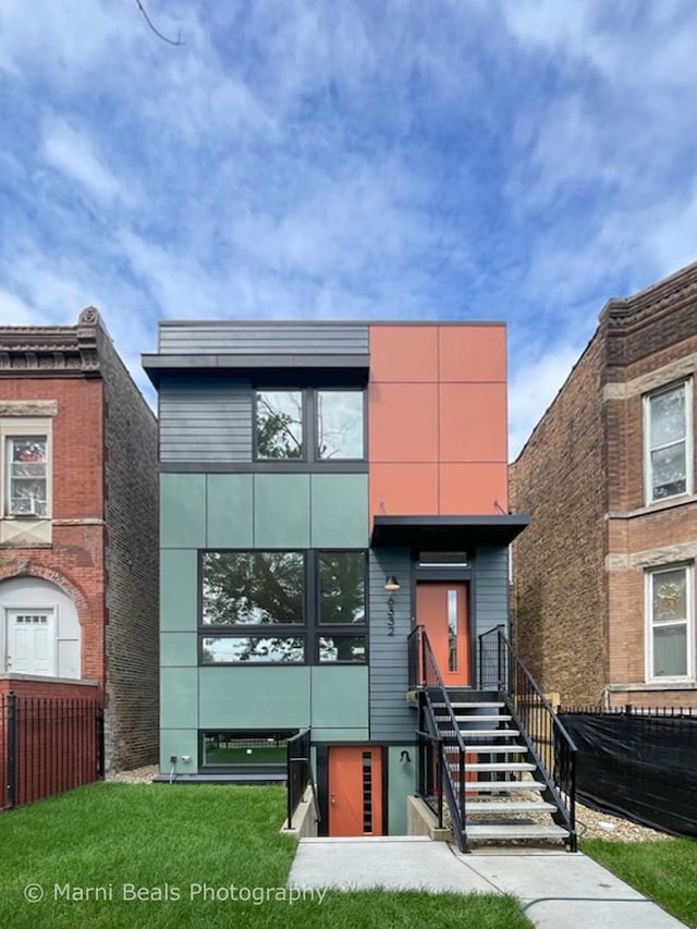 6517 S Saint Lawrence Ave, Chicago, IL 60637 - view of front facade featuring fence