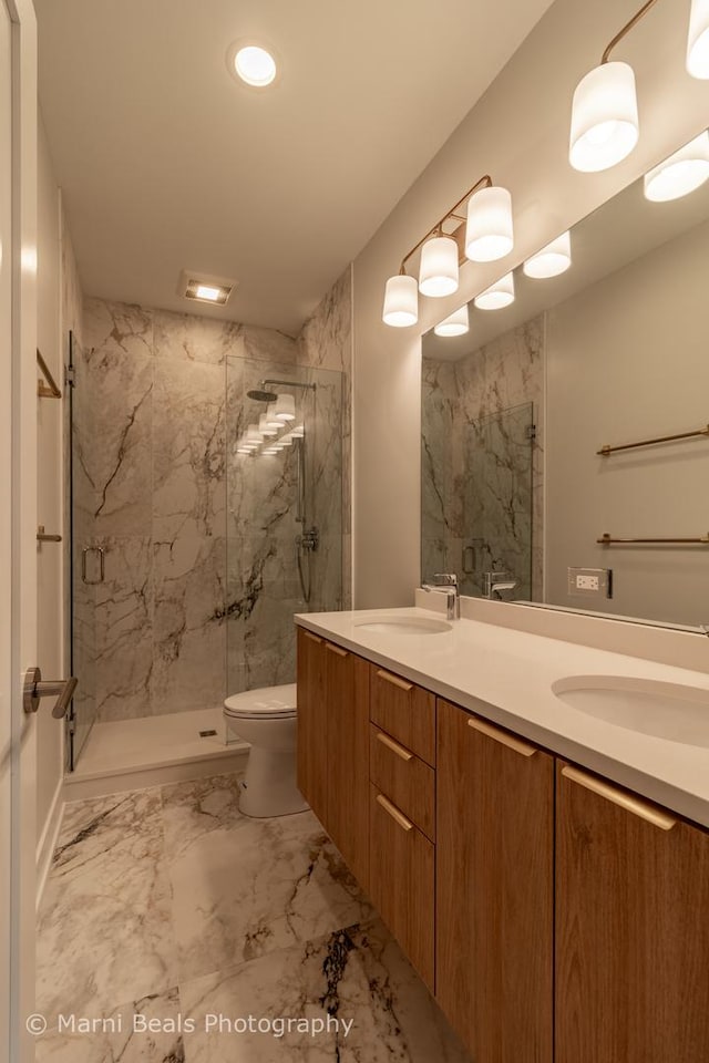 6517 S Saint Lawrence Ave, Chicago, IL 60637 - full bath with double vanity, a marble finish shower, and a sink