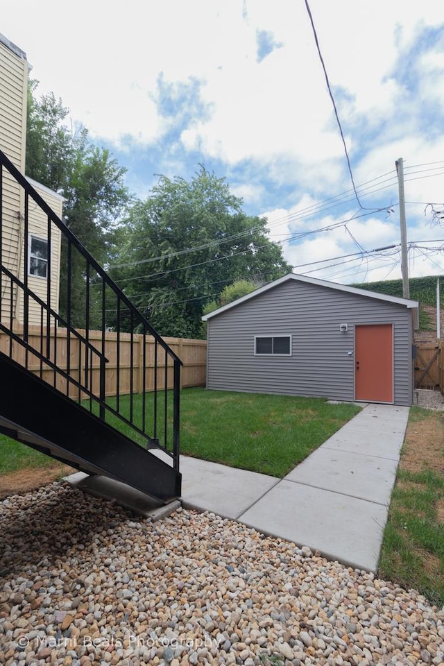 6517 S Saint Lawrence Ave, Chicago, IL 60637 - view of yard with an outbuilding, stairway, and a fenced backyard