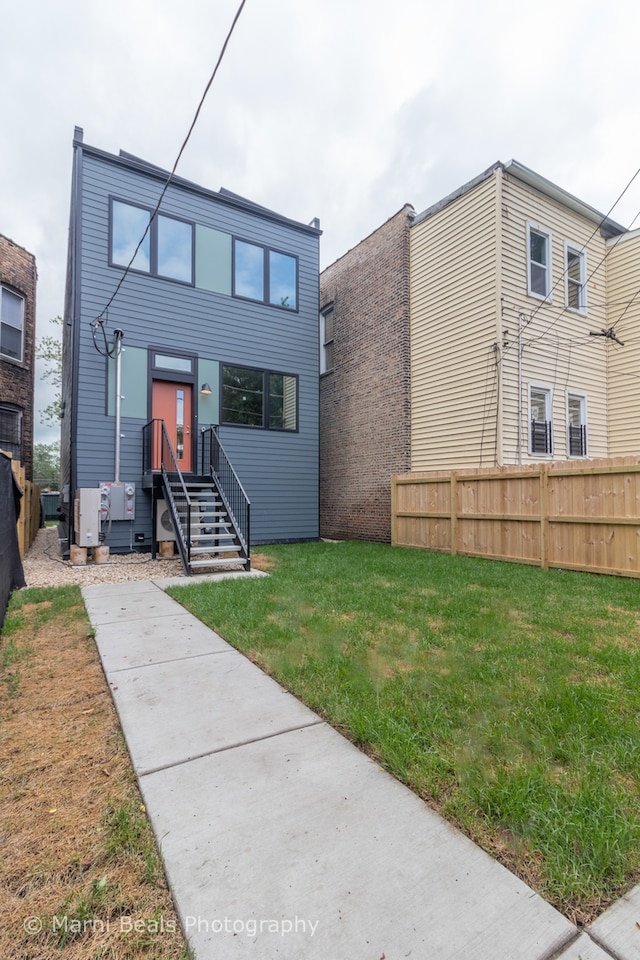 view of front of home with a front yard